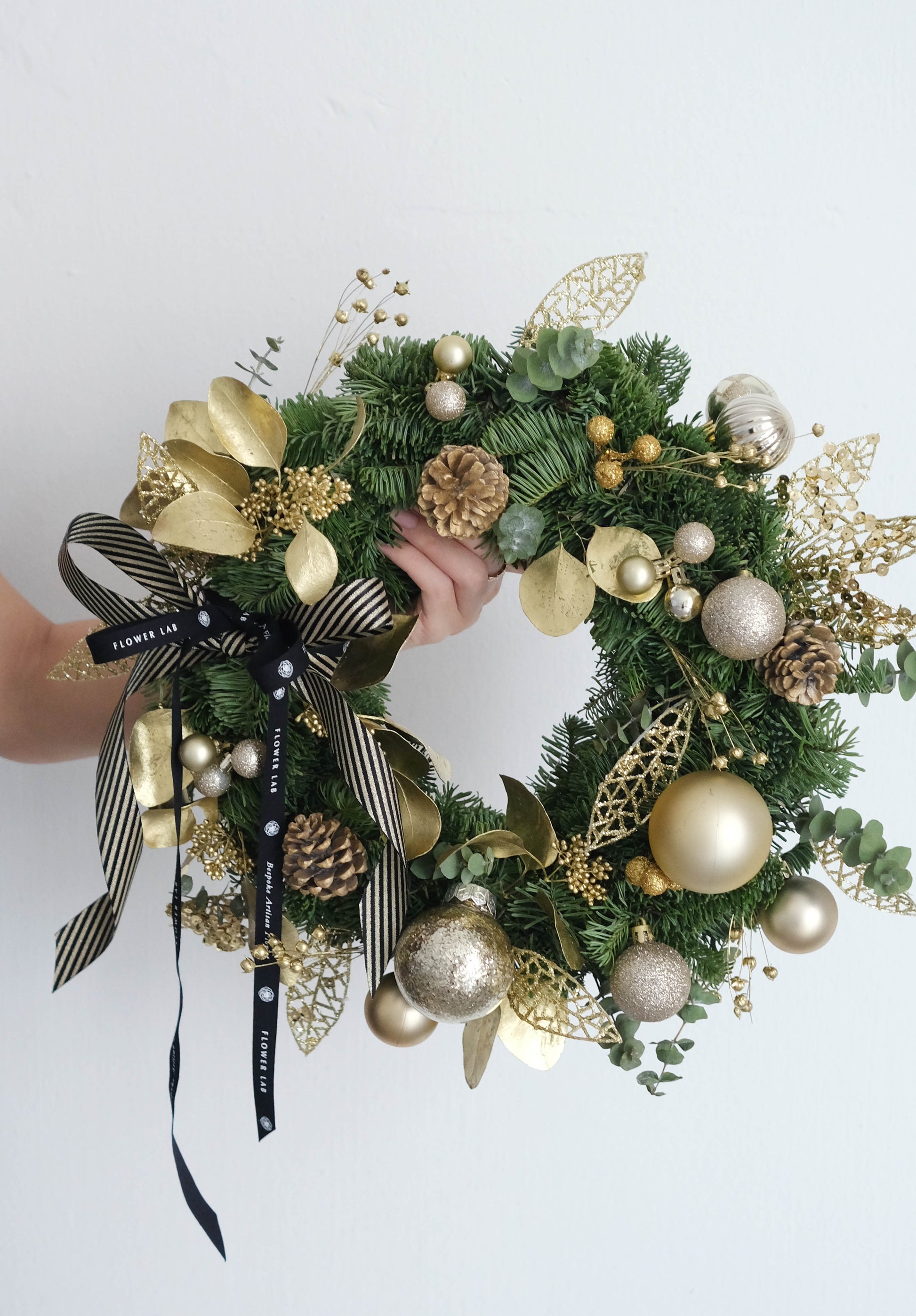 Flower Lab Singapore Christmas wreath with gold ornaments 
