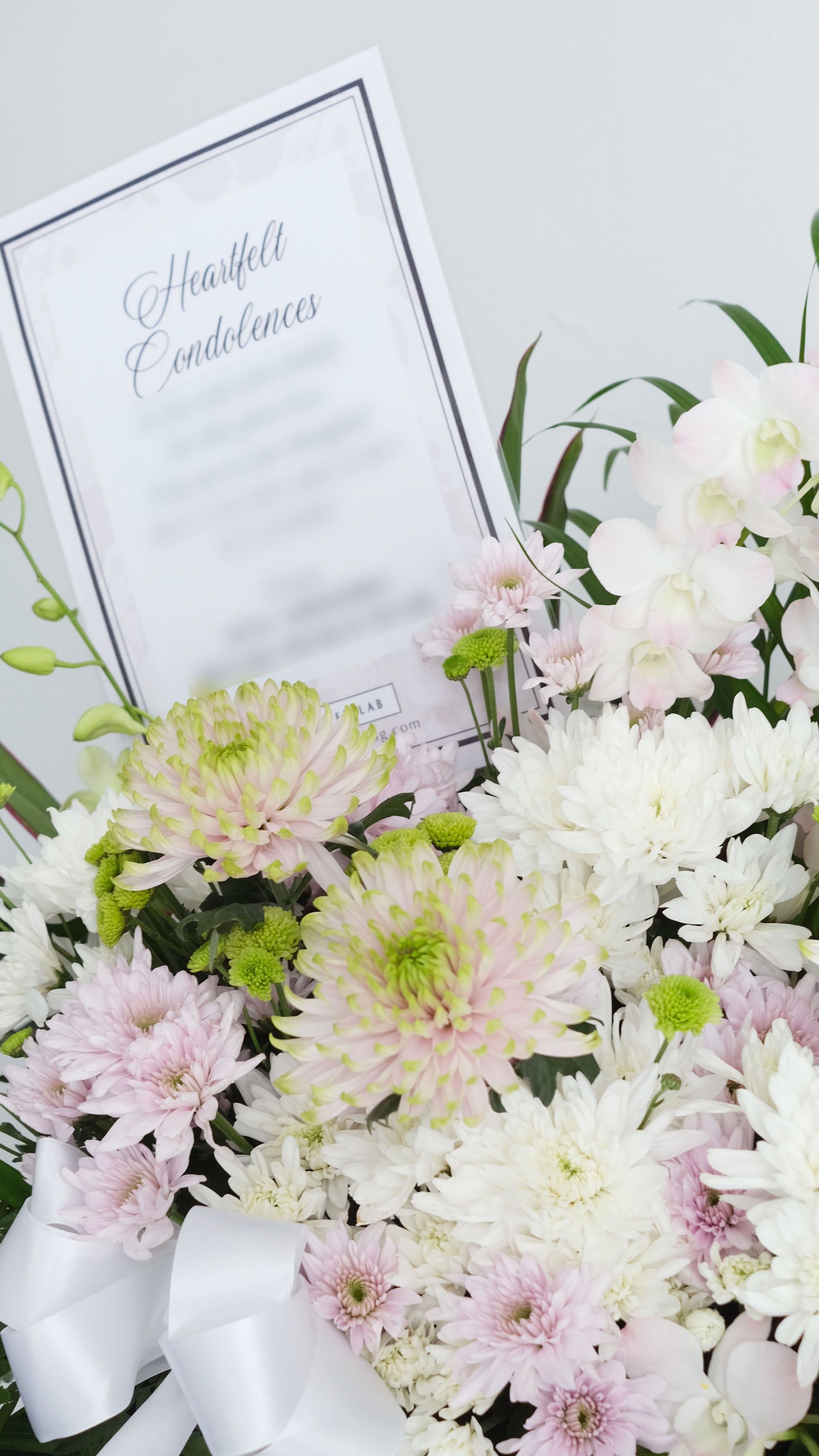 Condolence Sympathy Floral stand pale pink and white  chrysanthemum and orchids